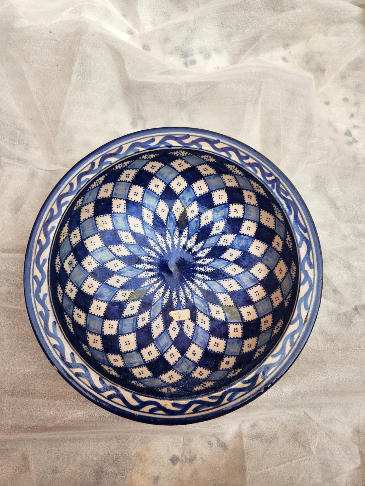 large and deep plate,decorated with dark blue