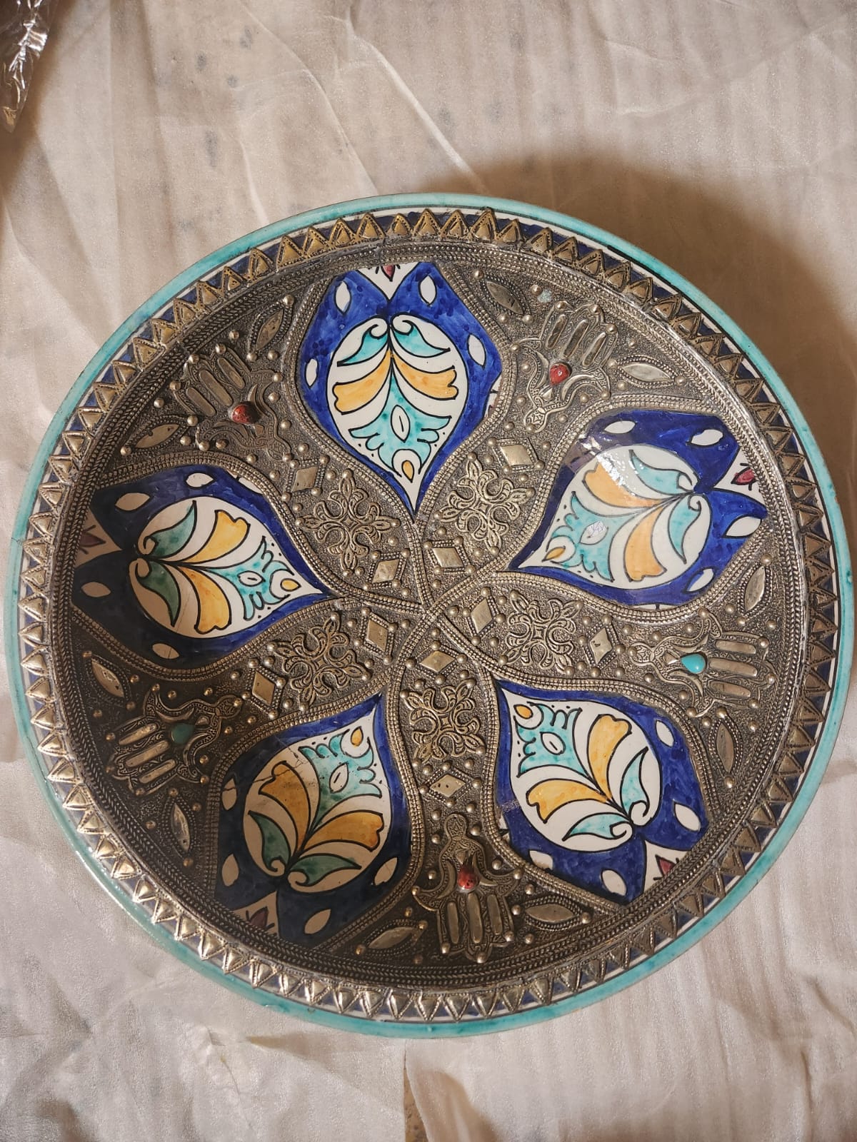 Large metal-mounted polychrome ceramic plate