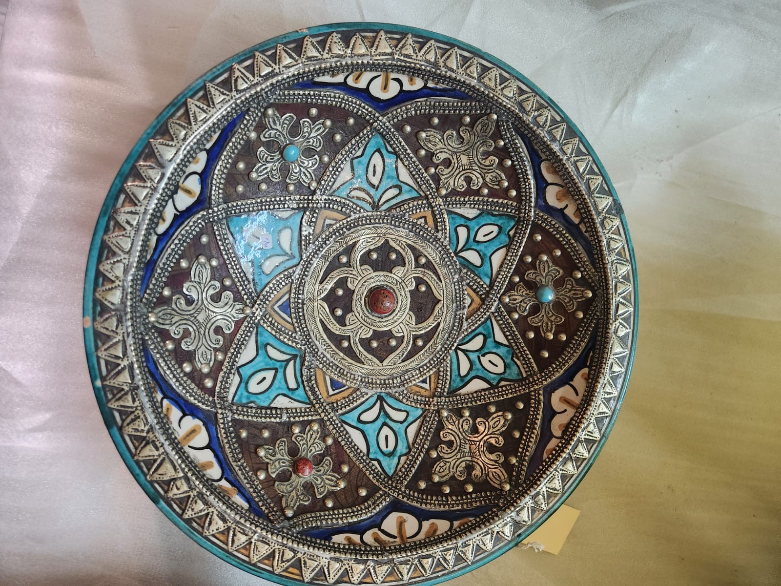 Large metal mounted polychrome ceramic plate