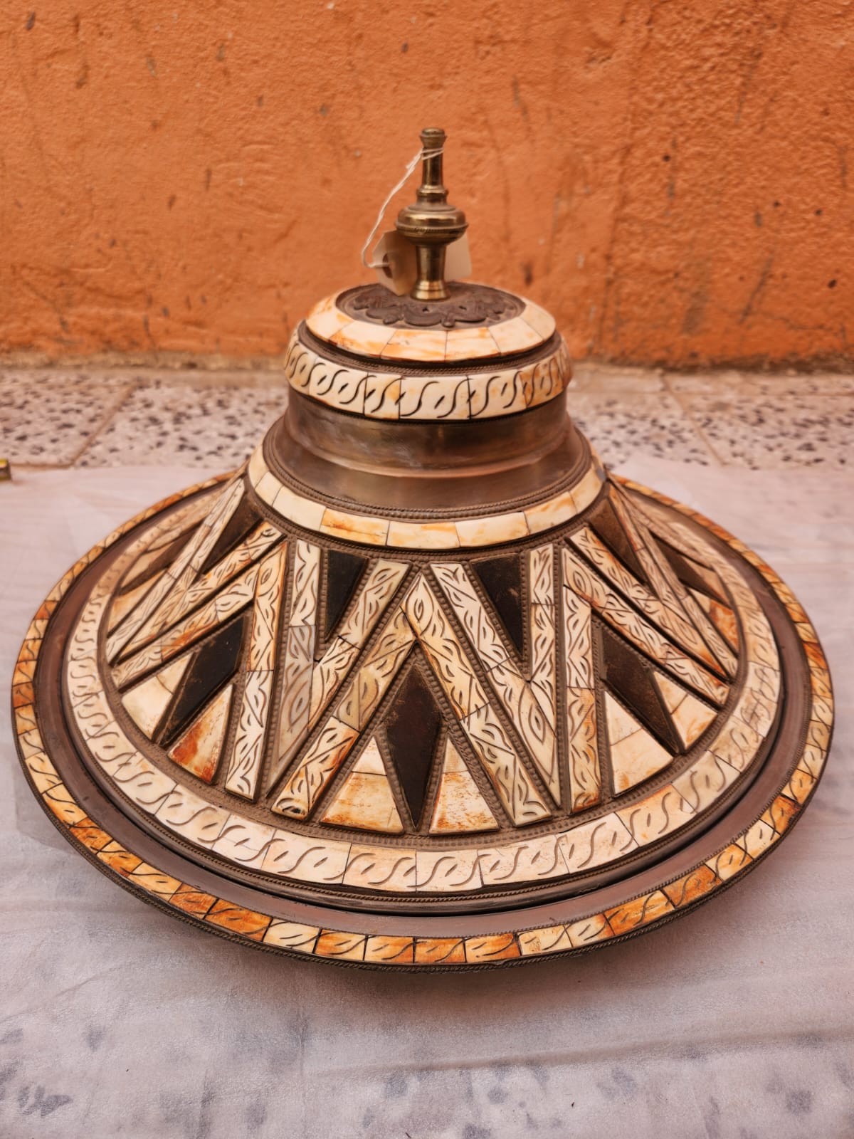 A large metal mounted camel bone Coucous serving dish